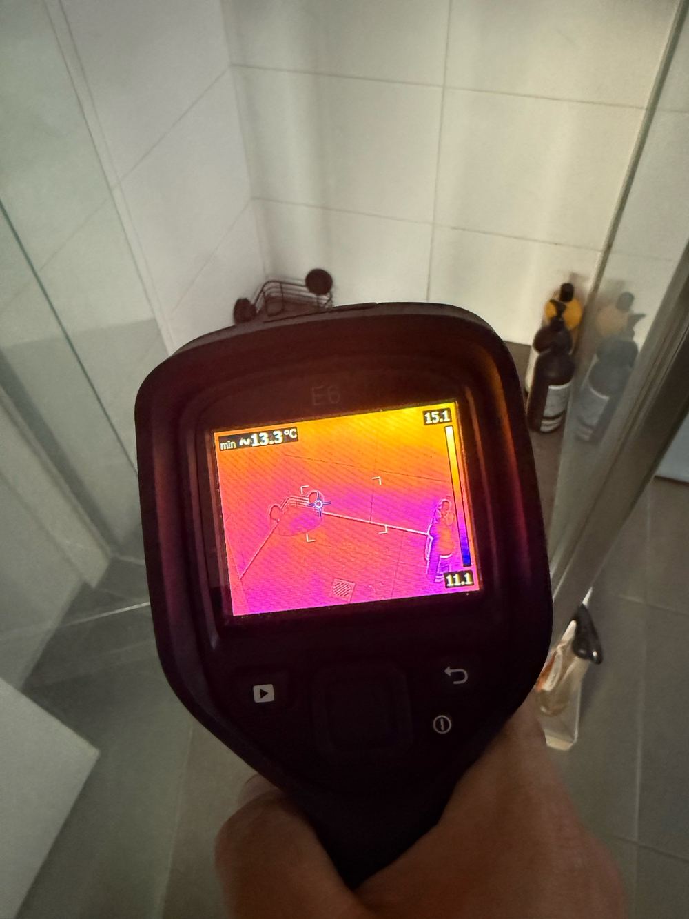Raised moisture readings low on the ensuite shower wall, found during a building and pest inspection in Officer