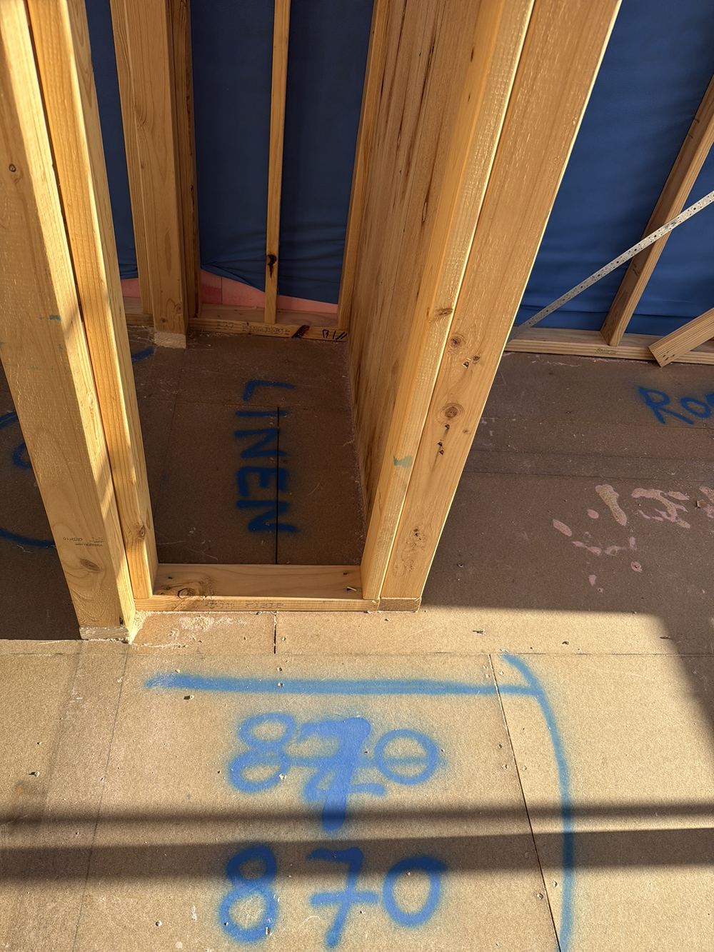 No blocking to a bracing wall between posi trusses, weakening its lateral restraint, found during a frame inspection in Officer