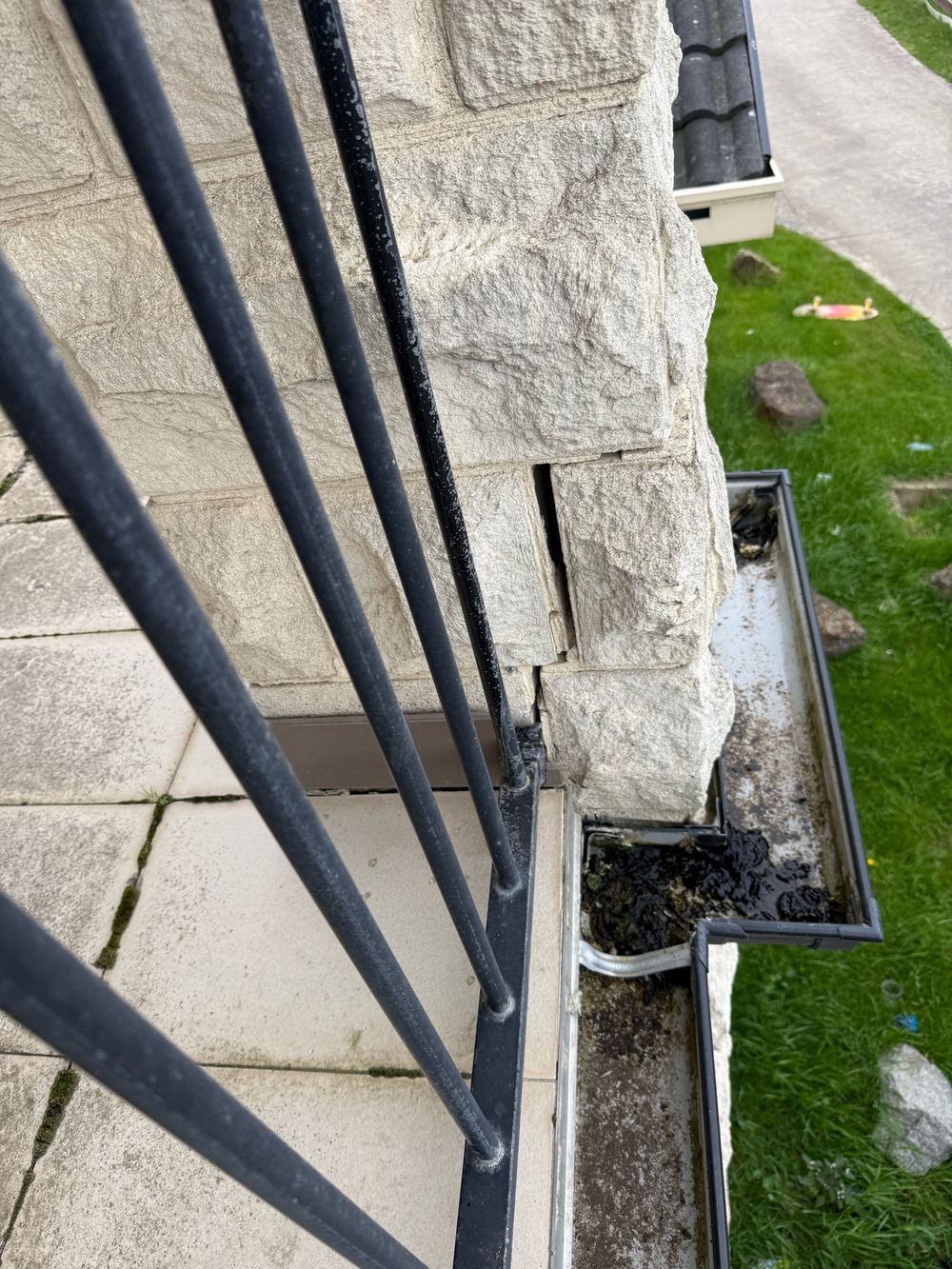 Limestone masonry cracked and displaced, no longer working as a sound support, found during a defect investigation inspection in Officer